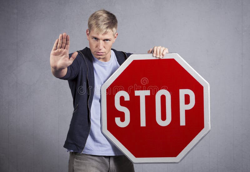 Man showing stop sign. stock image. Image of isolated - 28588709 Man showing stop sign. stock image. Image of isolated - 28588709